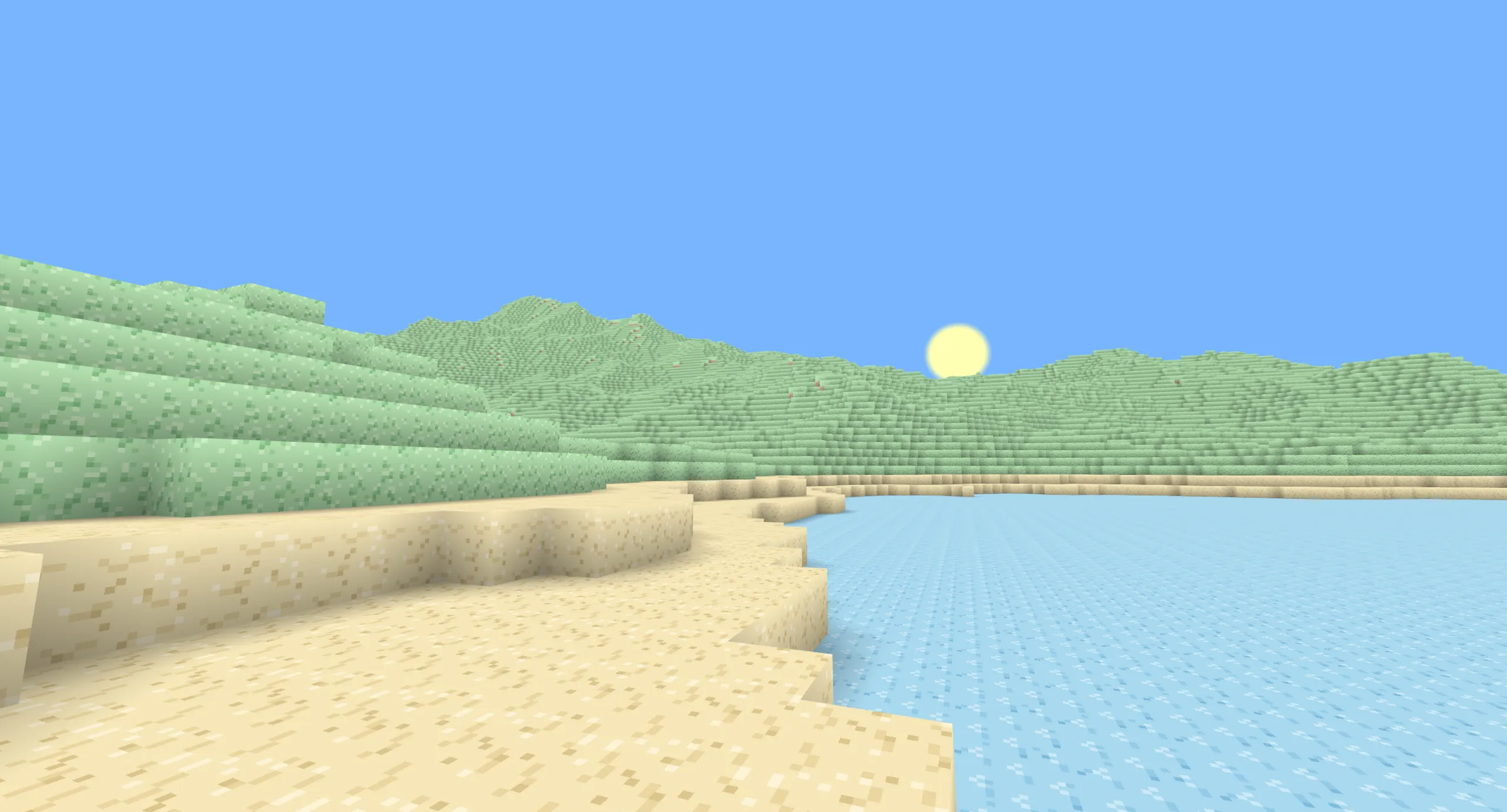 Terrain en voxels vu du dessus, avec eau, sable, herbe et montagnes